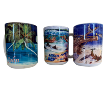 Three ceramic mugs featuring vibrant tropical and maritime-themed designs, each illustrating scenes like palm trees, beaches, and marine life, labeled "John" and "St. John.